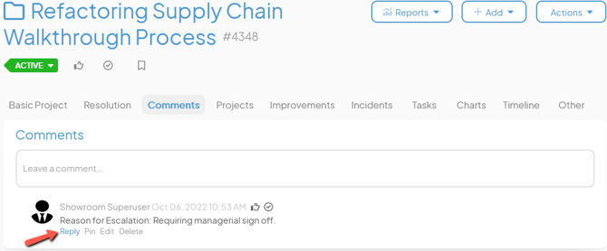 An Item work panel with an arrow pointing to the reply to comment button